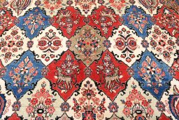 Corner detail of 2000s Sarough rug showing border pattern and Wool pile