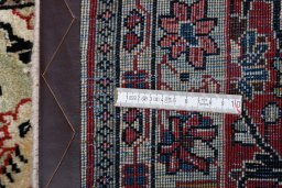 Corner detail of 2000s Sarough rug showing border pattern and Wool pile
