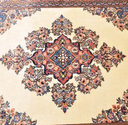 Corner detail of 2000s Sarough rug showing border pattern and Cork pile