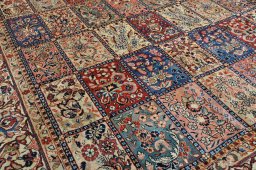 Surface texture of 2000s Sarough rug with natural Wool and intricate pattern