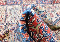 Close-up detail of 2000s Sarough rug from Iran / Persia showing Wool weave