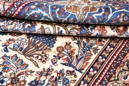 Surface texture of 2000s Sarough rug with natural Wool and intricate pattern