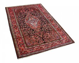 Corner detail of 2000s Sarough rug showing border pattern and Wool pile