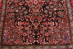 Backside of handmade 2000s Sarough rug showing knot structure and weave density
