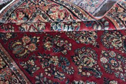 Corner detail of 1970s Sarough rug showing border pattern and Wool pile