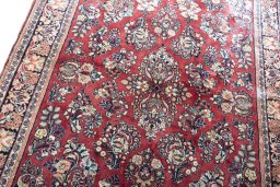 Backside of handmade 1970s Sarough rug showing knot structure and weave density