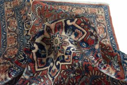 Surface texture of 2000s Sarough rug with natural Cork and intricate pattern