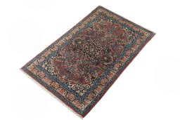 Corner detail of 2000s Sarough rug showing border pattern and Cork pile