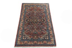 Surface texture of 2000s Sarough rug with natural Cork and intricate pattern