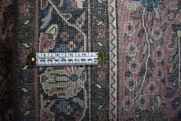Backside of handmade 1930s Sarough rug showing knot structure and weave density