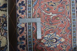 Backside of handmade New Sarough rug showing knot structure and weave density