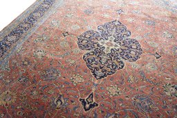 Backside of handmade New Sarough rug showing knot structure and weave density