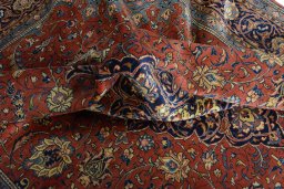 Surface texture of 2000s Sarough rug with natural Wool and intricate pattern