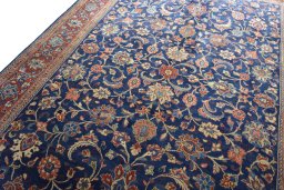 Backside of handmade 1970s Sarough rug showing knot structure and weave density