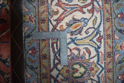 Backside of handmade New Sarough rug showing knot structure and weave density