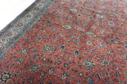 Backside of handmade New Sarough rug showing knot structure and weave density