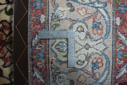 Backside of handmade 2000s Sarough rug showing knot structure and weave density