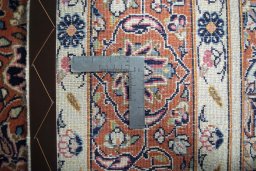 Backside of handmade New Sarough rug showing knot structure and weave density