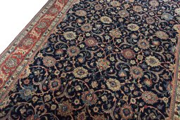 Backside of handmade New Sarough rug showing knot structure and weave density