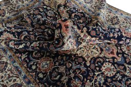 Surface texture of 2000s Sarough rug with natural Wool and intricate pattern