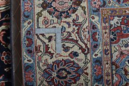 Backside of handmade 2000s Sarough rug showing knot structure and weave density