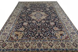 Surface texture of 2000s Sarough rug with natural Wool and intricate pattern