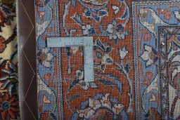 Backside of handmade New Sarough rug showing knot structure and weave density