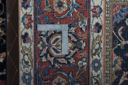 Backside of handmade 1970s Sarough rug showing knot structure and weave density