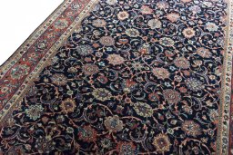 Backside of handmade 1970s Sarough rug showing knot structure and weave density