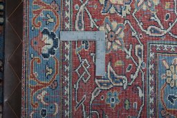 Backside of handmade New Sarough rug showing knot structure and weave density