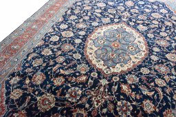 Backside of handmade New Sarough rug showing knot structure and weave density