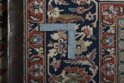 Backside of handmade New Sarough rug showing knot structure and weave density