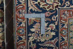 Backside of handmade New Sarough rug showing knot structure and weave density