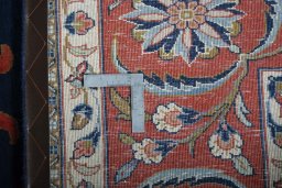 Backside of handmade New Sarough rug showing knot structure and weave density