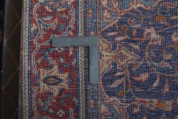 Backside of handmade New Sarough rug showing knot structure and weave density