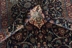 Surface texture of 2000s Sarough rug with natural Wool and intricate pattern