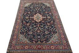 Surface texture of 2000s Sarough rug with natural Wool and intricate pattern
