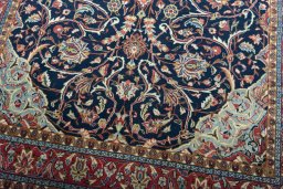 Close-up detail of 2000s Sarough rug from Iran / Persia showing Wool weave