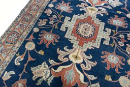 Backside of handmade New Sarough rug showing knot structure and weave density