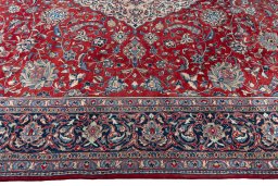 Corner detail of 2000s Sarough rug showing border pattern and Wool pile