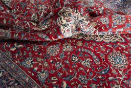 Surface texture of 2000s Sarough rug with natural Wool and intricate pattern