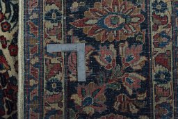 Backside of handmade 1930s Sarough rug showing knot structure and weave density