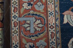 Backside of handmade New Sarough rug showing knot structure and weave density