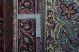 Backside of handmade 1970s Sarough rug showing knot structure and weave density