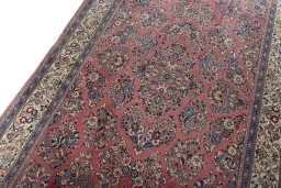 Backside of handmade 1970s Sarough rug showing knot structure and weave density