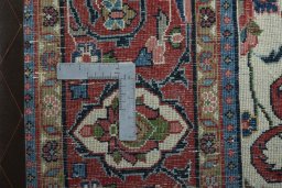 Backside of handmade 1970s Sarough rug showing knot structure and weave density