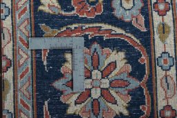 Backside of handmade New Sarough rug showing knot structure and weave density