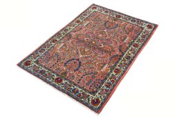 Corner detail of 2000s Sarough rug showing border pattern and Wool pile