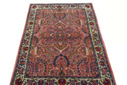 Surface texture of 2000s Sarough rug with natural Wool and intricate pattern