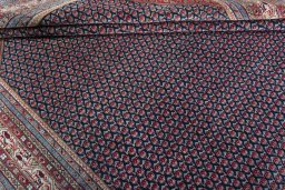 Corner detail of 1970s Sarough rug showing border pattern and Wool pile